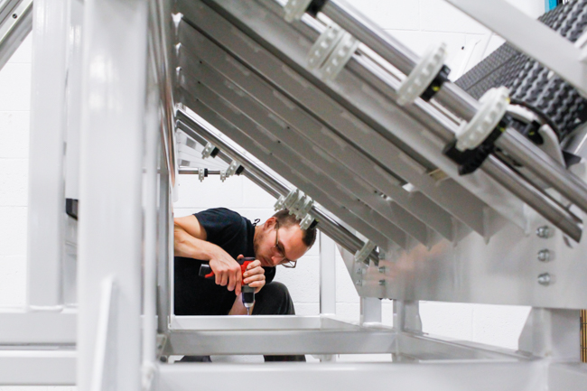 NūMove's employee screwing a platform