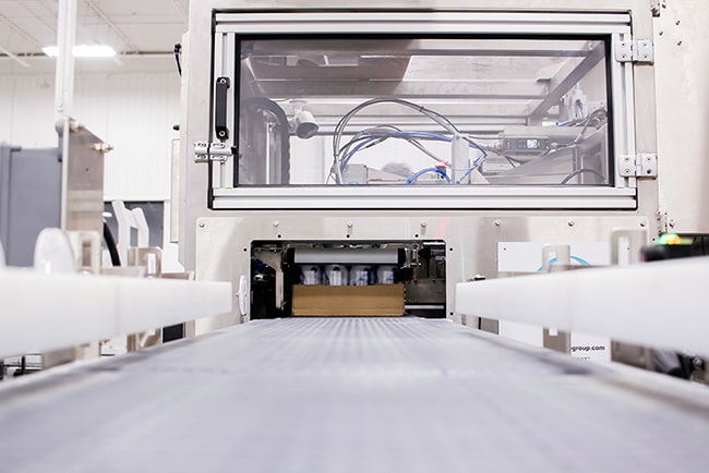 beverage uncasing system