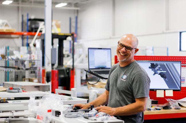 NūMove's employee smiling in the warehouse